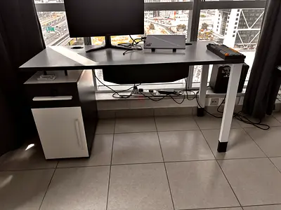Modern black and white office computer desk with storage cabinet