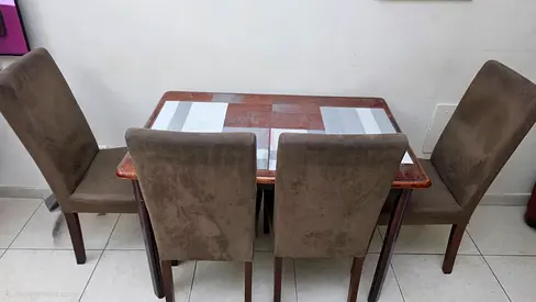 Wooden dining table with 4 upholstered chairs - good condition