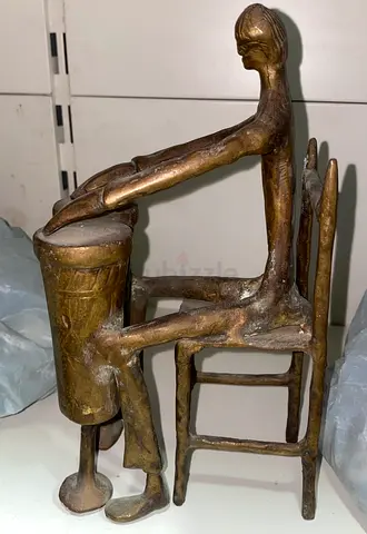 Antique brass sitting man sculpture