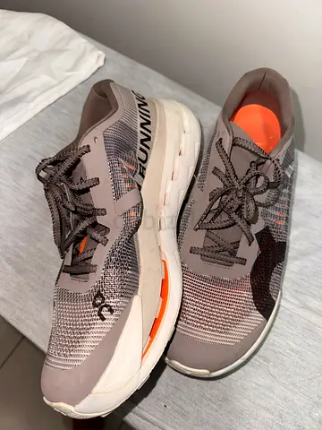 Light brown/grey running shoes, size not specified - lightly used