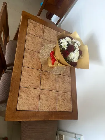Wooden dining table with tiled top and 4 chairs - good condition