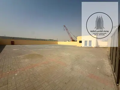 10,000 Sq Ft Yard on Sand Road with Office, Bathroom & 15 KW – Sajaa Industrial