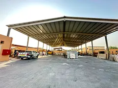 Spacious Industrial Yard For Sale with 15,000 Sq. Ft. Covered Shed 120 KVA Electricity in Al Sajaa