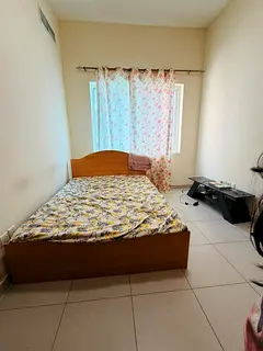 Family room with attached bath in Alnadha 2 Near pond park .