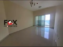2BR for annual rent in Julphar Tower, Ajman. 2 baths, balcony & free parking. AED 42,000/year, 4 pa