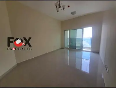 2BR for annual rent in Julphar Tower, Ajman. 2 baths, balcony & free parking. AED 42,000/year, 4 pa