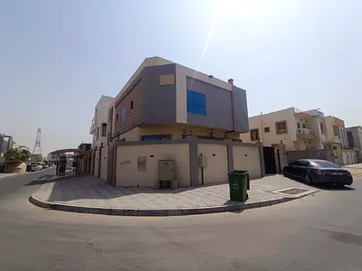 Villa for rent in Al Yasmeen: corner unit featuring 6 master bedrooms, a majlis, two living areas,