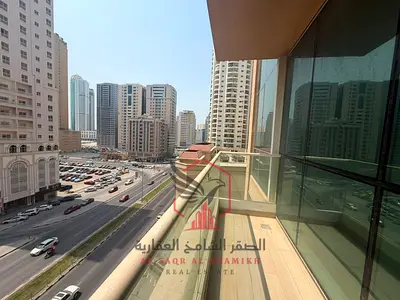 Free parking, gym & pool! Annual rent in Al Majaz 3: huge 2BR, 2 master rooms, sea-view balcony, laundry room, 3 baths, spacious kitchen and new finis