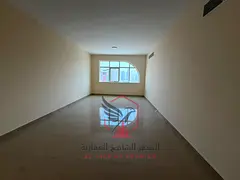 Brand-new 2BR + living, free parking, 1 month free, prime location near all services and Dubai exit.