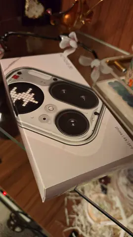 nothing phone 4a pro pink with nothing ear (Open)