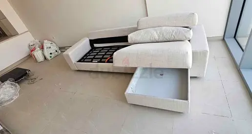 Light beige 3-seater sofa bed with storage compartment, good condition