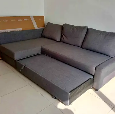 Grey L-shaped pull-out sofa bed – good condition