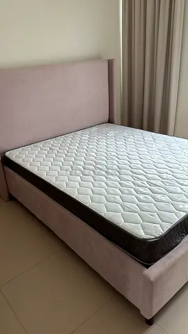 Well-kept king  bed frame with mattress - light pink upholstered