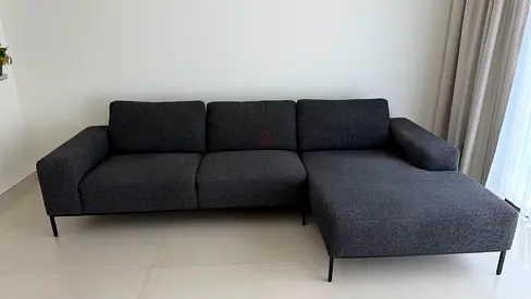Modern dark grey L-shaped 3-seater sofa with chaise