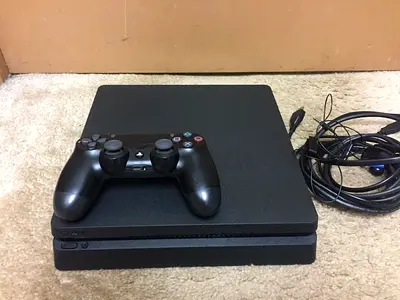 Used Sony PlayStation 4 Slim with Controller and Cables - Good Working Condition