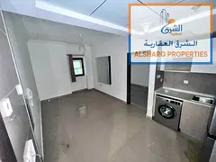 "Spacious studio with a balcony and excellent layout in Clock Tower Tower, Al Rashidiya 1, featuring