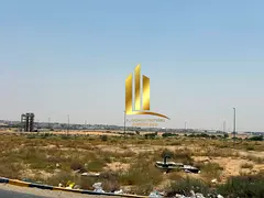 Corner commercial land for sale in Sharjah, Al-Ruqaiba Al-Sayouh area (Al-Tai Commercial), freehold 