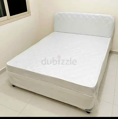 Queen size upholstered bed with mattress and headboard - white