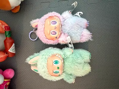 Pair of pastel plush labubu collectible toys with keyring - mint and pink