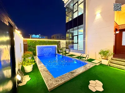 Luxury villa for sale in Al Amrah – Ajman | Two floors + roof, 6 master bedrooms with private pool, elegant design and spacious areas, including air c