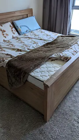 Solid wood-look double bed frame with mattress - good condition