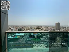 Annual 2BR hall in City Tower Ajman, closed kitchen, master room, open-view balcony, central AC; ren