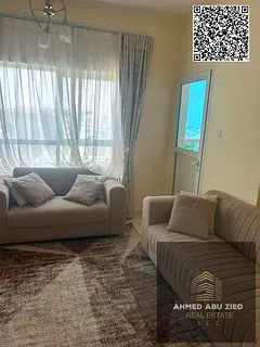 Furnished 1BR hall in Orient Towers Ajman with pool, gym, parking, garden; annual rent AED 40,000 in