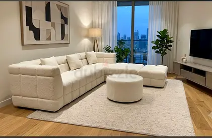Modern L-shaped Cream Modular Sofa with Ottoman — Excellent Condition