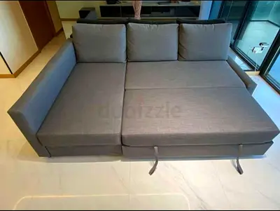 Grey L-shaped sofa bed - converts to double bed, good condition