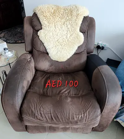 Brown single recliner armchair - AED 100