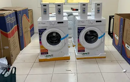 Coin operated washing machine system available for labour camp residential buildings and villas