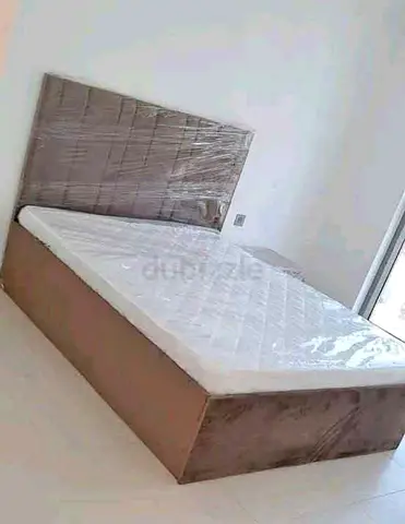 Queen bed frame with mattress — new