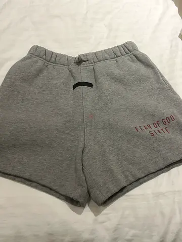 Grey 'Fear of $%&' casual shorts, size approx M