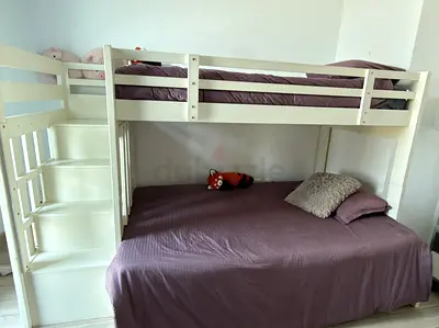 White wooden bunk bed with stairs - double on bottom, single on top