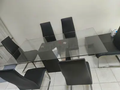 Luxury Glass dinning table with 6 Leather chairs