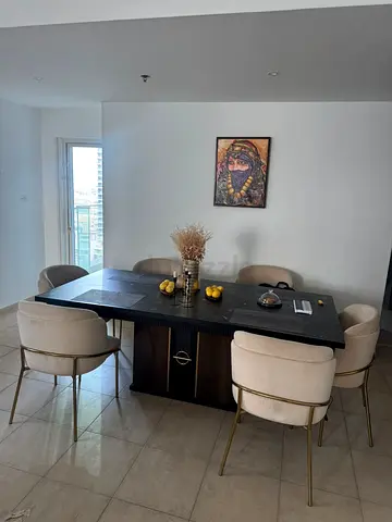 Modern Black Dining Table with 6 Beige Chairs - Good Condition