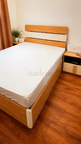 Wooden IKEA bed with storage and matching beside tables