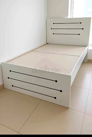 Double white wooden bed frame with headboard and storage-ready base