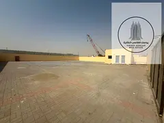 10,000 Sq Ft Yard on Sand Road with Office, Bathroom & 15 KW – Sajaa Industrial