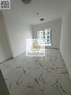 Studio for annual rent in Al Waha Towers – Ajman ✨ Completely separate kitchen 👨‍👩‍