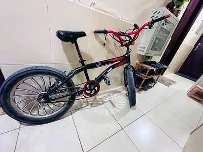 Used BMX-style kids' bike with mag wheels - good condition