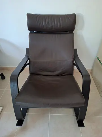Comfortable brown leather reclining lounge chair with headrest