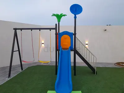 Outdoor kids playset with slide, swings and ladder - good condition