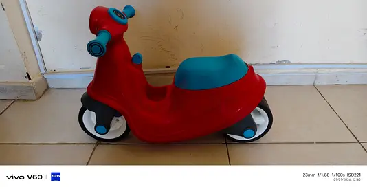 Red and blue toddler ride-on scooter - good used condition