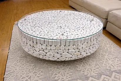 Handcrafted round coffee table crafted from stacked natural wood logs