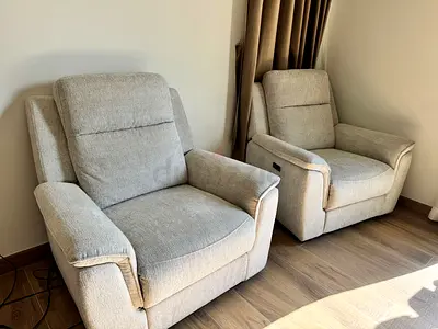 Pair of light grey fabric recliner armchairs - comfortable and clean