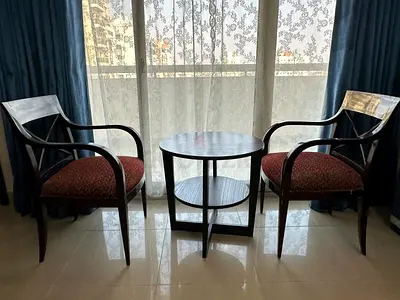 Pair of wooden armchairs with round side table - good condition