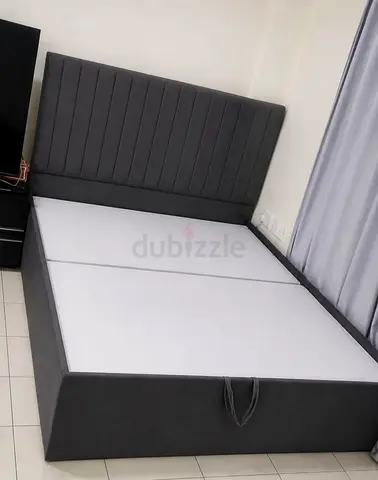 Grey upholstered double bed frame with storage, good condition