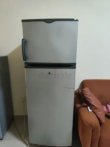 Silver double-door refrigerator - used in working condition but less cooling