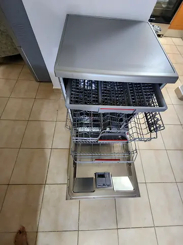 Stainless steel built-in dishwasher with multiple racks - like new condition. Light usage only